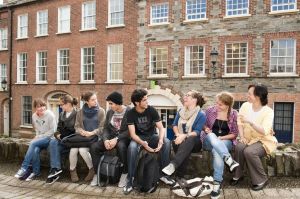 Students from many Schools Talking on a Wall