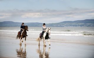 Students Horse Riding on an Irish Beach