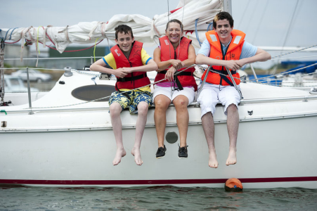 Students and Host Family Mother pose for a Picture on a Boat