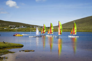 Boats Sailing Across an Irish Lake